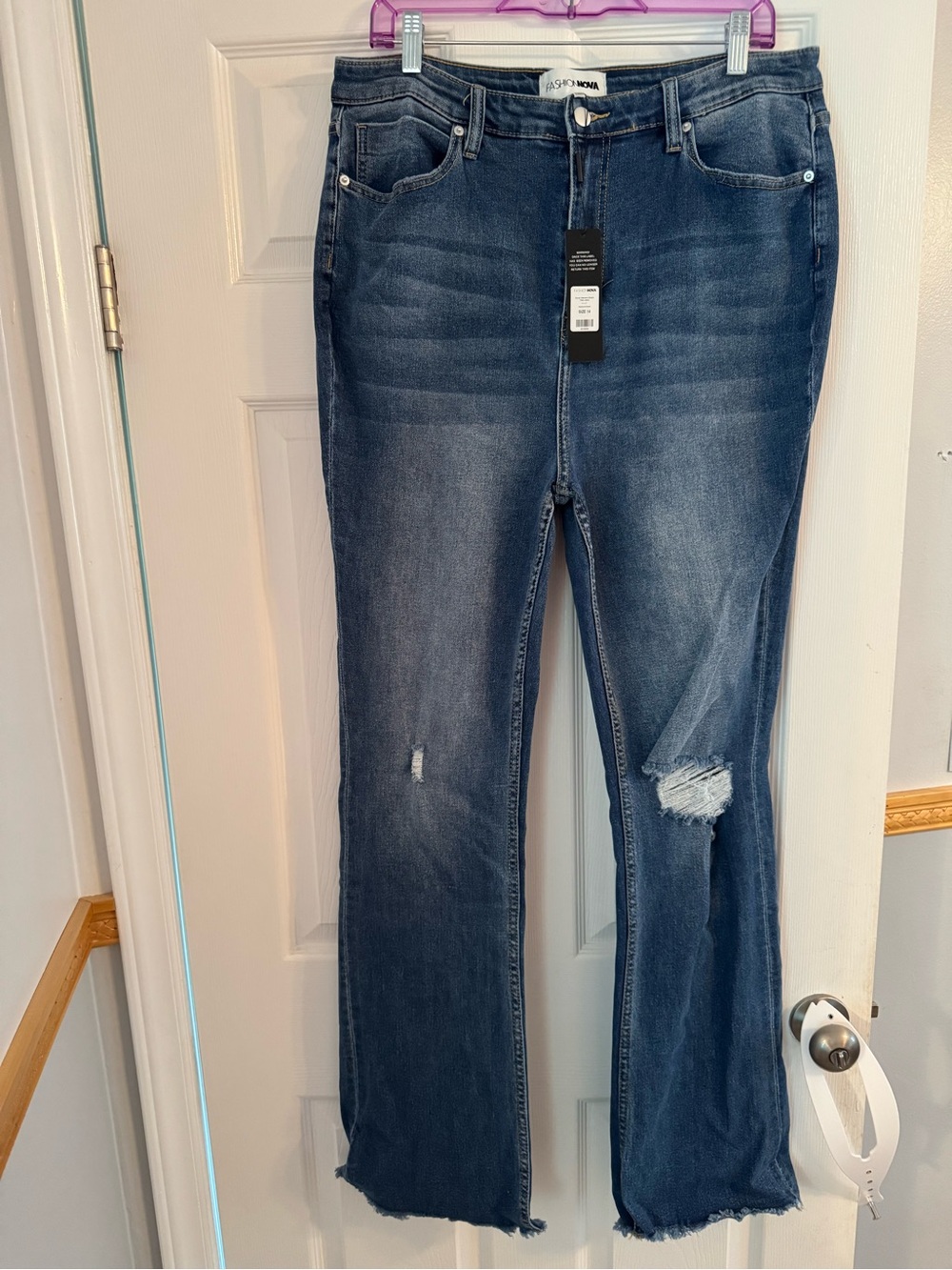 Fashion Nova Dark Blue Flare Jeans with Distressed Knees